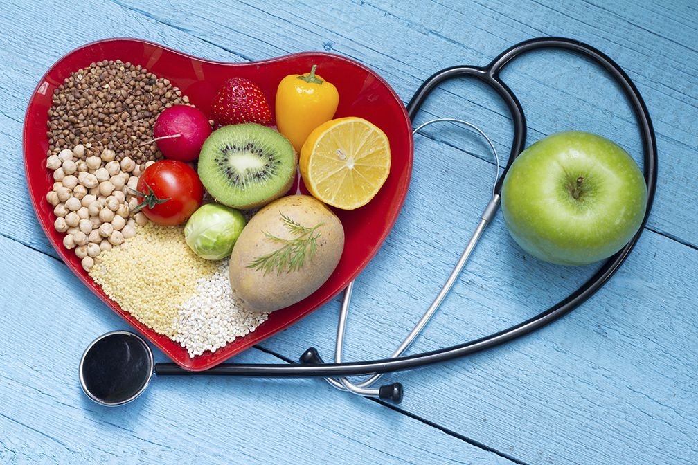Heart-healthy foods including fruits, vegetables, whole grains, nuts, and fatty fish in 2026.